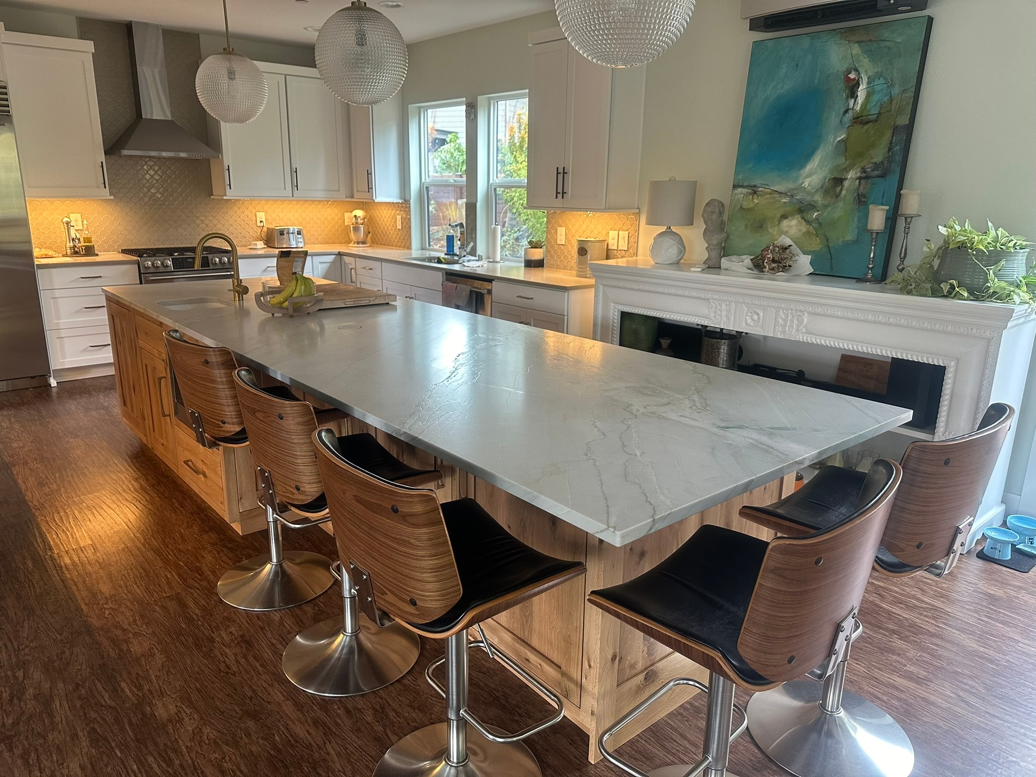 Luxury kitchen with quartz waterfall island countertop